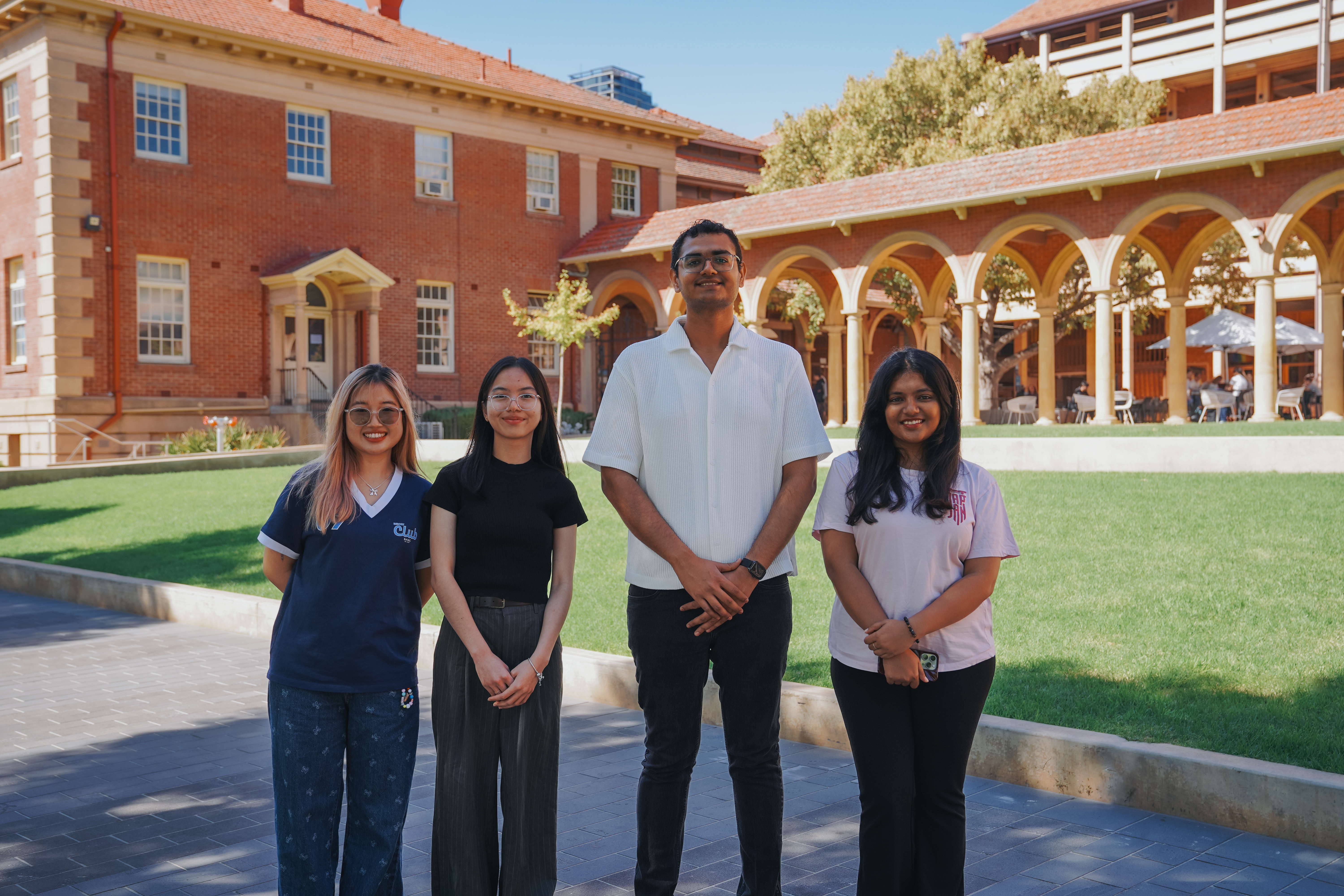 20223 SEDs stand arm in arm outside the Cloisters. Pictured left to right is Ernest, Yanyan, Annie and Shania